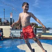 Harry Cakebread, 9, jumps through a fountain at Gorleston Splashpad.