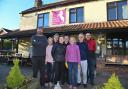 Staff and volunteers outside the White Horse pub in Upton.