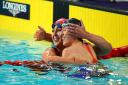 Jessica-Jane Applegate, left, and Northern Ireland's Bethany Firth celebrate at the end of the women's 200m freestyle S14