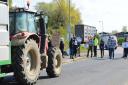 Animal rights activists stopping farmers\' vehicles at an earlier protest at Norwich Livestock Market