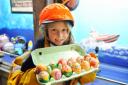Caister Lifeboat holding a Easter Egg hunt over the bank holiday weekend. Scouts, guides and local school children have handmade the eggs for the visitors to find.Hannah King (dressed as a crew member) on holiday with her family holding some eggs