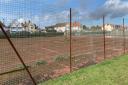 Gorleston tennis courts have weeds growing through the asphalt.