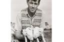 Eric Cook farmed wheat, barley, oats, beans, sugar beet, and potatoes and kept cattle, pigs, and chickens. He is pictured here holding what might possibly be the world's most adorable piglets