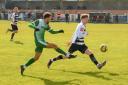 Gorleston's Nathan Stewart crosses the ball against Tilbury