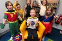Finnie Egleton and his friends dressed as superheroes