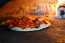 Enjoy bottomless wood-fired pizza at The Horse and Groom pub