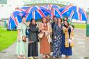 Spirits remained high despite the rain at the start of Ladies Evening at Great Yarmouth Racecourse. Picture - Sonya Duncan