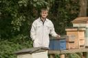 Young beekeeper Cullen Brown by some of his hives. Picture - Sonya Duncan