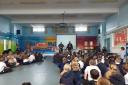 A pair of police officers talk about anti-social behaviour at Northgate Primary School in Great Yarmouth.
