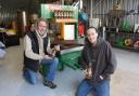Russell and Archie Watson by their apple press in Scratby. Picture - Denise Bradley