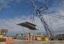 The Matador 3 crane from Rotterdam sky lifting the first section of the £121 million pound bridge
