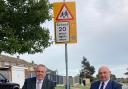 County Councillors Carl Smith and Carl Annison at one of the new 20mph signs in Bradwell.