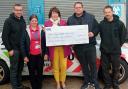 Ben Walters, Lisa Hutchinson, James Paget University Hospital Charity manager Maxine Taylor, Runham Garage owner Danny Barnard and Richard Hutchinson with the funds raised in the Screwball Rally. Picture - Runham Garage