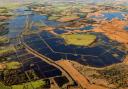 Heigham Holmes, seen from above during recent floods, has long been the subject of rumours it was a secret Second World War airfield.