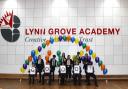 The principal and students from Lynn Grove Academy celebrate the Good Ofsted report