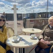 Vivienne George and Mary Brown, old school friends from Caister, enjoy a cuppa by the sea on Monday April 12. Gorleston's Pier Hotel was a popular spot for a morning brew in the sunshine.