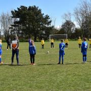 A minute's silence is impeccably observed by players and officials from Waveney Thundercats U11 and Ormesby Lads U11 at Dip Farm in Lowestoft in memory of the Duke Of Edinburgh, Prince Philip, before development football resumed in the East Point Sports