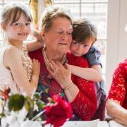 Phyllis Ecclestone at her 90th birthday celebrations. She is seen with two great grandchildren and family friend Dot Hill