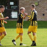 Beccles celebrate their third goal against Acle in a match which ended all square at 3-3. Picture: ANTONY KELLY