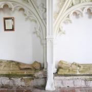 The effigies of a medieval knight and his wife, both originally clutching stone hearts as hers has been defaced, at Wickhampton Church. Picture: DENISE BRADLEY