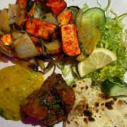 A delicious plateful of panner takka, tarka dhal, saag aloo and Peshwari naan from Planet Spice.