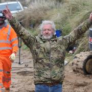 Lance Martin celebrates his Hemsby home being saved Picture: Denise Bradley