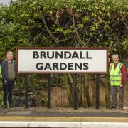 The new sign is unveiled at Brundall Gardens station
Picture: Wherry Lines Community Rail Partnership