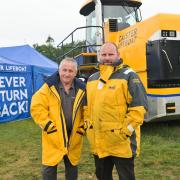 Dick and Richard Thurlow in front of Caister Lifeboat's new £250k tractor at the Royal Norfolk Show. Picture - Sonya Duncan