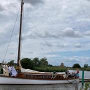 The Bishop of Norwich heads on the wherry to St Benet's Abbey