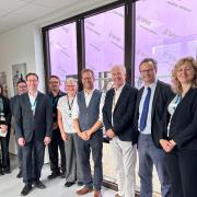 Lord Markham (fifth from right), MP Peter Aldous (third from right) and the New Hospital Programme team met James Paget staff during a tour of the hospital