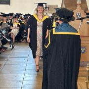 A beaming student at the graduation ceremony Picture: Newsquest