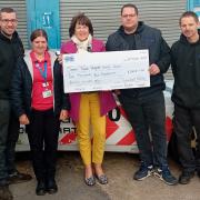 Ben Walters, Lisa Hutchinson, James Paget University Hospital Charity manager Maxine Taylor, Runham Garage owner Danny Barnard and Richard Hutchinson with the funds raised in the Screwball Rally. Picture - Runham Garage