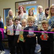 Author Louise Gooding (centre-left) officially opened the revamped library at Homefield. Picture - Homefield CE VC Primary