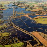 Heigham Holmes, seen from above during recent floods, has long been the subject of rumours it was a secret Second World War airfield.
