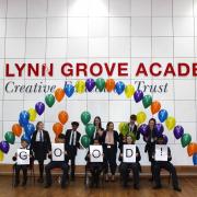 The principal and students from Lynn Grove Academy celebrate the Good Ofsted report