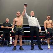 Ryan Walsh's arm is raised in victory by referee  Sean McAvoy