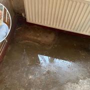 Edward Stewart has been living with a puddle in his living room due to an ongoing water leak. Pictures - James Weeds