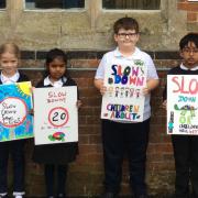 Reedham Primary School have designed posters to encourage drivers to slow down