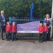 Swallowtail Federation joins St Benet's MAT from Left Richard Cranmer CEO of St Benet's MAT,  Mrs Natatlie Butcher Executive Headteacher and children