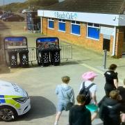 Police greeting the boys outside the Beach Cafe near the Marrams in Hemsby after the first gun shot was fired