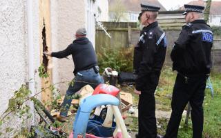 Police break into a house on Keyes Close for Operation Gravity searching for suspected drugs users. Picture: DENISE BRADLEY