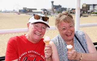 Holidaymakers Rose Jolly, left, and Diane Armsby, enjoying the hazy sunny weather in Great Yarmouth in 2023. Picture - Denise Bradley